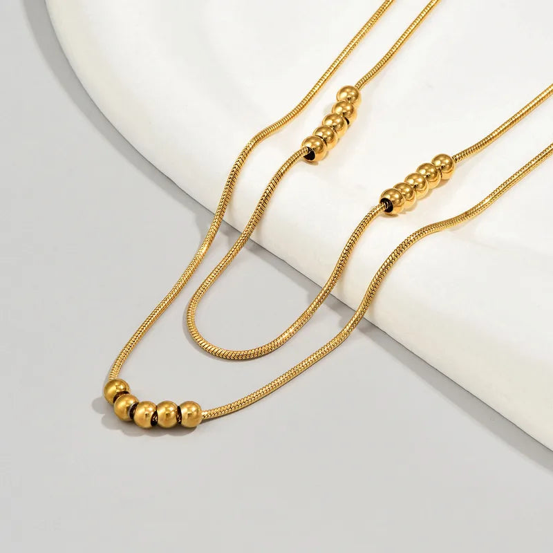 Collier femme multirangs dore acier inoxydable