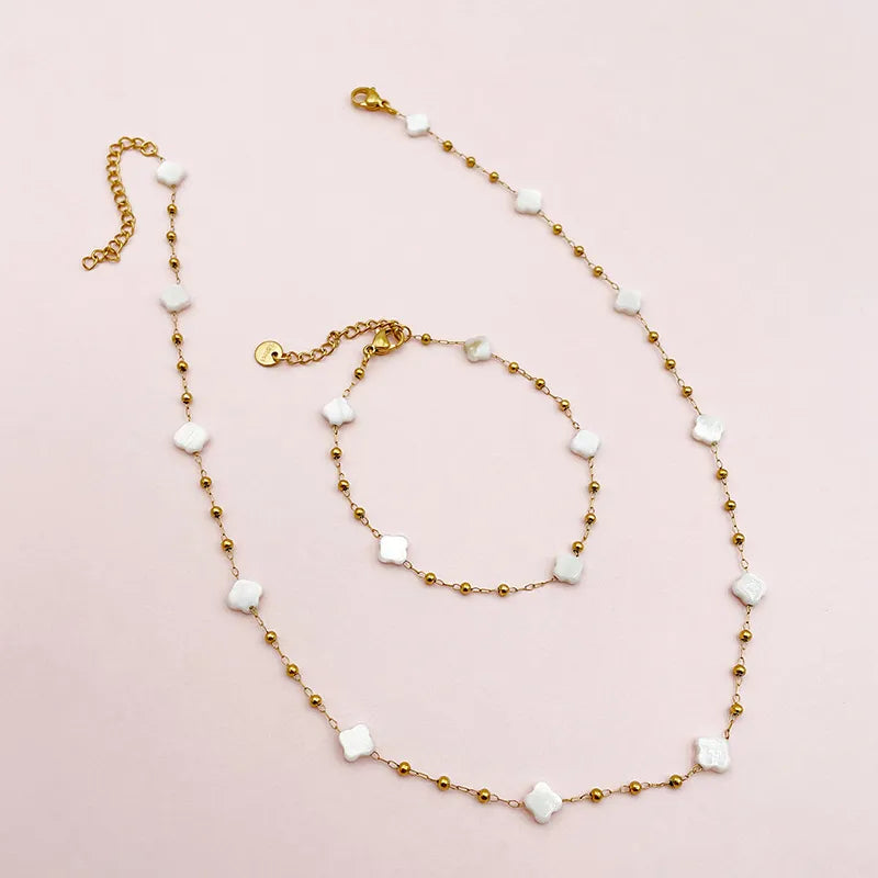 Parure acier dond rore trèfles nacres collier et bracelet