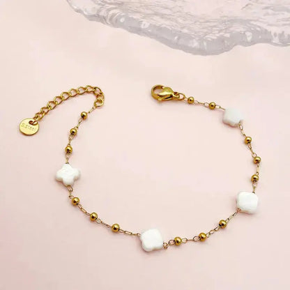 Bracelet avec des fleurs en nacre en acier